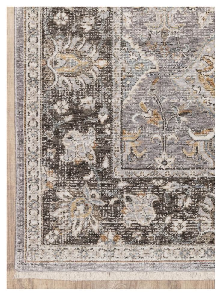 an area rug with various colors and patterns on it, including brown, beige, gray and white