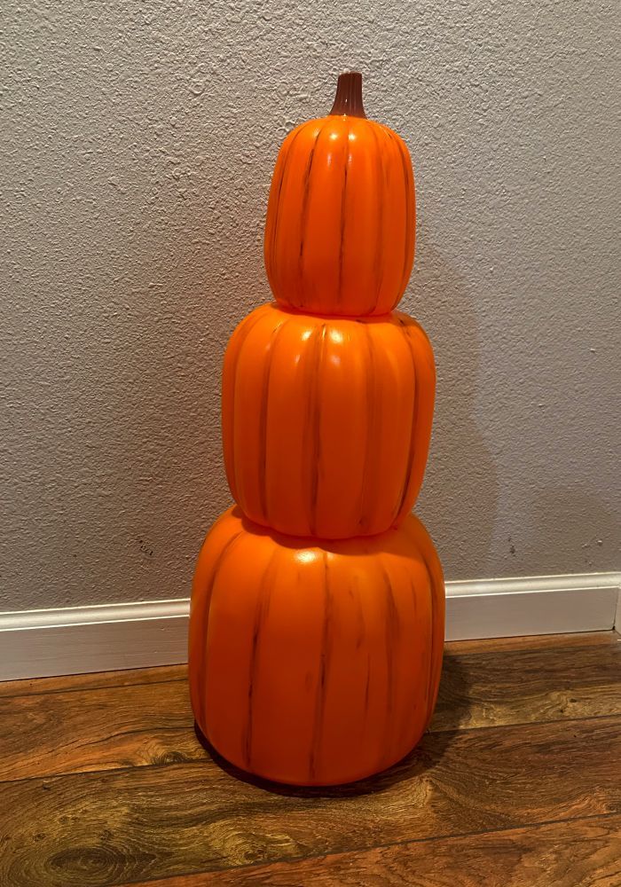 three pumpkins stacked on top of each other