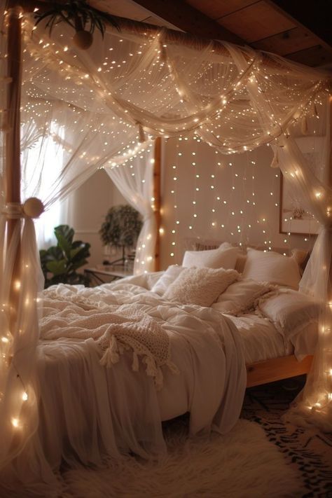 a bed with white sheets and lights on the headboard, in a bedroom decorated for christmas