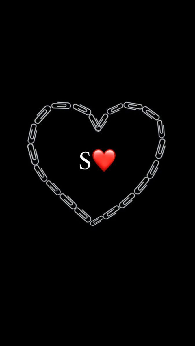 a heart with chains and the letter s on it