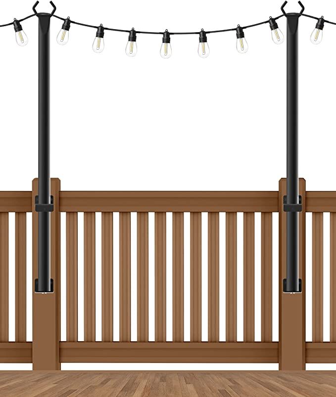 a wooden deck with lights on it and two poles holding the railings up to each other