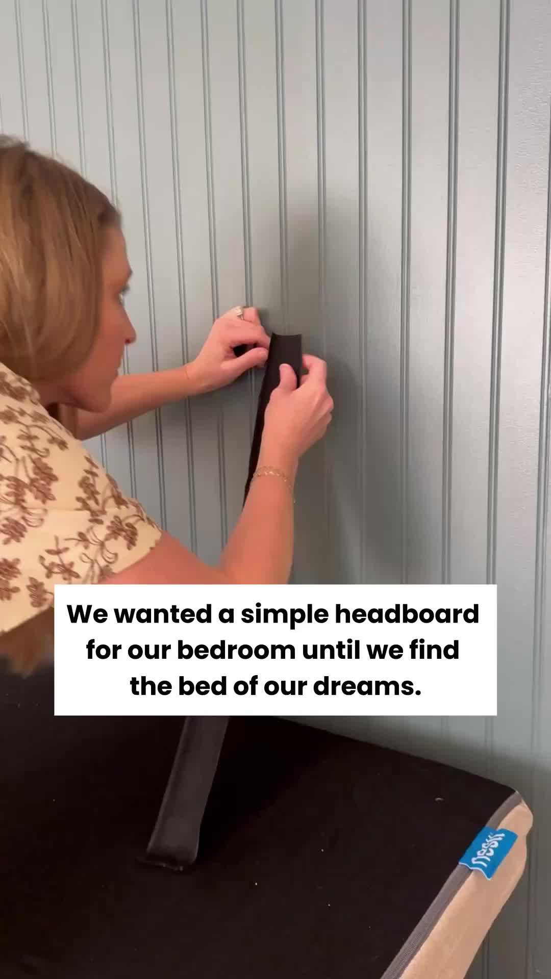 This may contain: a woman is fixing the back of a bed with her headboard and foot rest