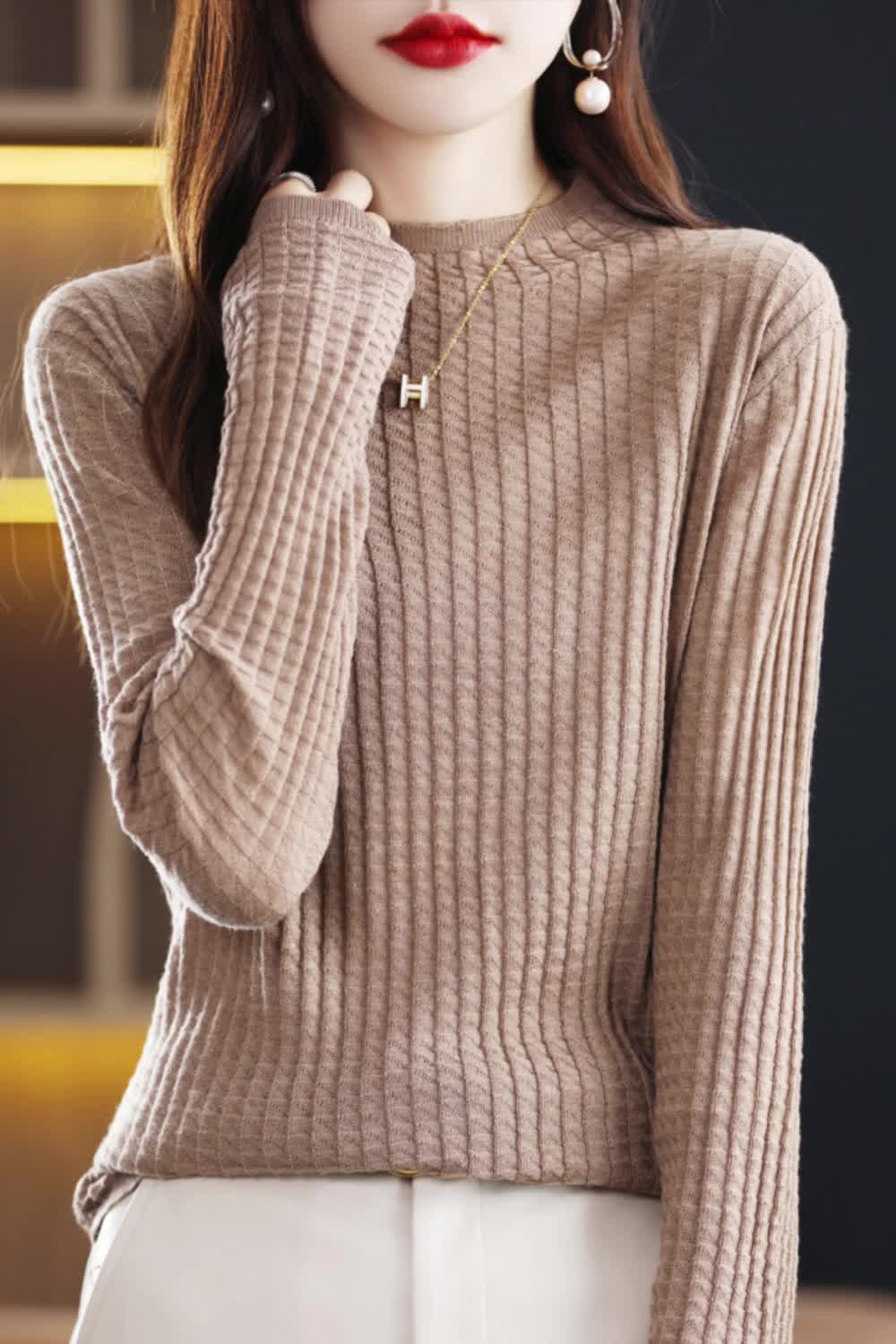 This contains: Upgrade your wardrobe with our fashionable Spring 2024 collection. Our Women's Sweater Knit Pullover features a chic turtleneck design and high-quality knit, providing both style and comfort. Perfect for any occasion, this top will elevate your outfit. Available now!