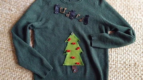 A homemade green Christmas jumper with felt decorations (Credit: Matilda Welin)