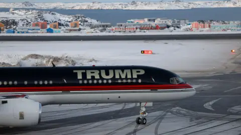 Reuters An aircraft with Trump written on it carrying Donald Trump Jr arrives at an airport in Nuuk, Greenland.