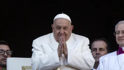 Pope Francis leads the traditional Urbi et Orbi Christmas Day blessing from the central balcony of Saint Peter's Square at the Vatican City, 25 December 2024.