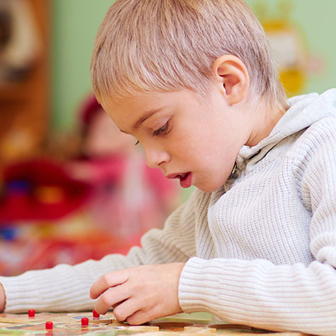 Young child working on a puzzle