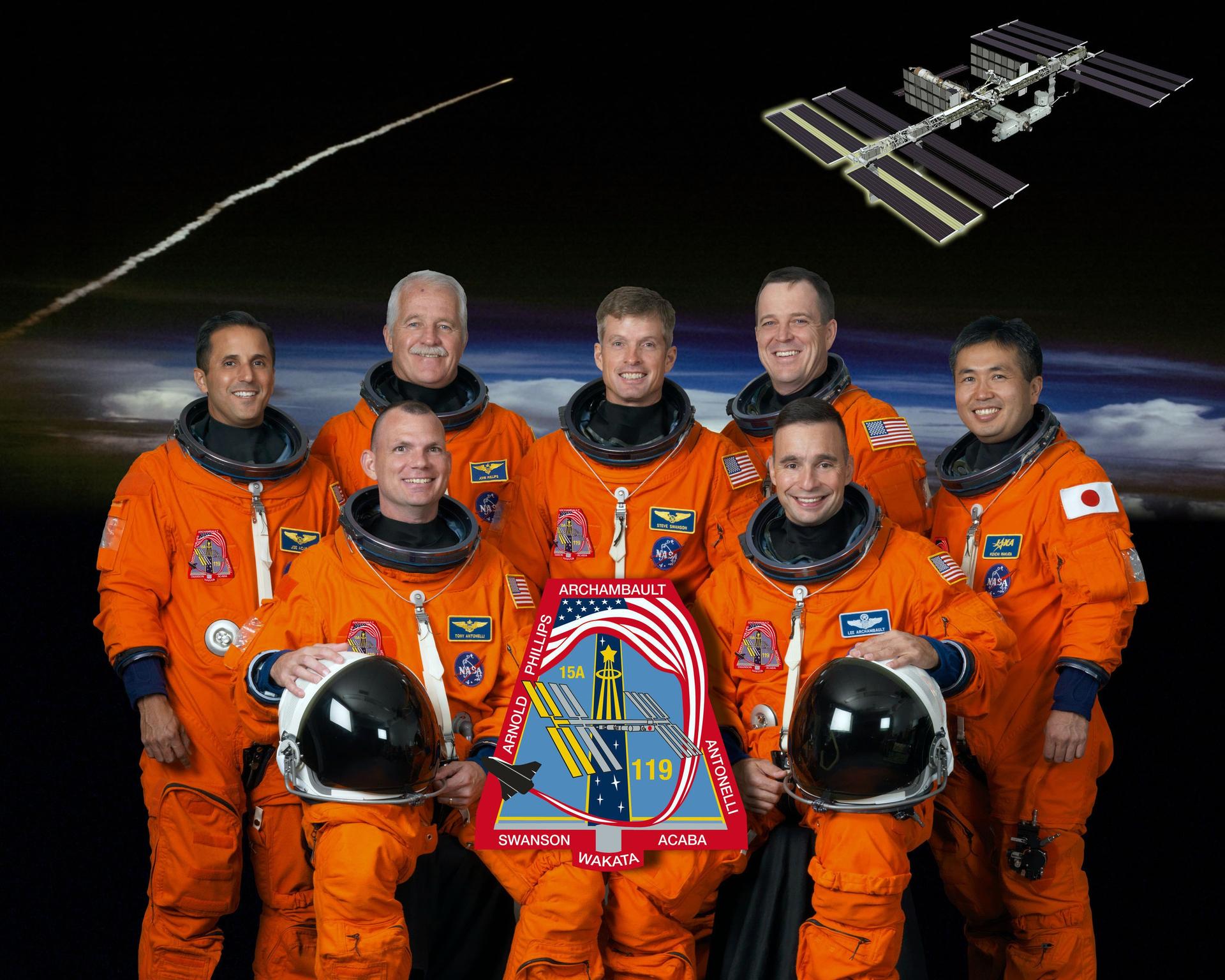 STS-119 crew in their orange flight suits
