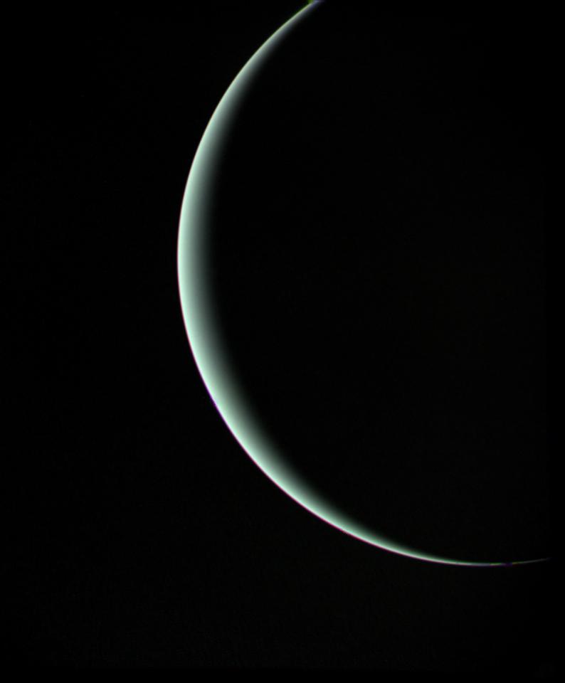 This view of pale blue-green Uranus was recorded by NASA Voyager 2 on Jan 25, 1986, as the spacecraft left the planet behind. The thin crescent of Uranus is seen here between the spacecraft, the planet and the Sun.