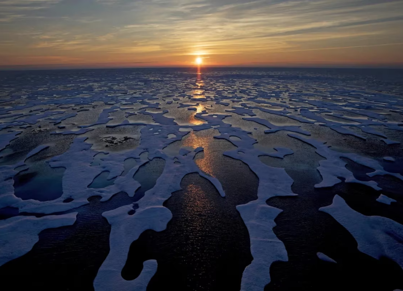 midnight sun shines across sea ice along the Northwest Passage in the Canadian Arctic Archipelago, on July 22, 2017. DAVID GOLDMAN/THE ASSOCIATED PRESS