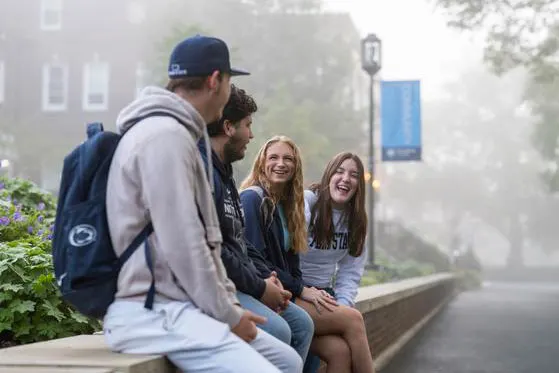 Photo of students sitting and talking outdoors on Schuylkill's campus