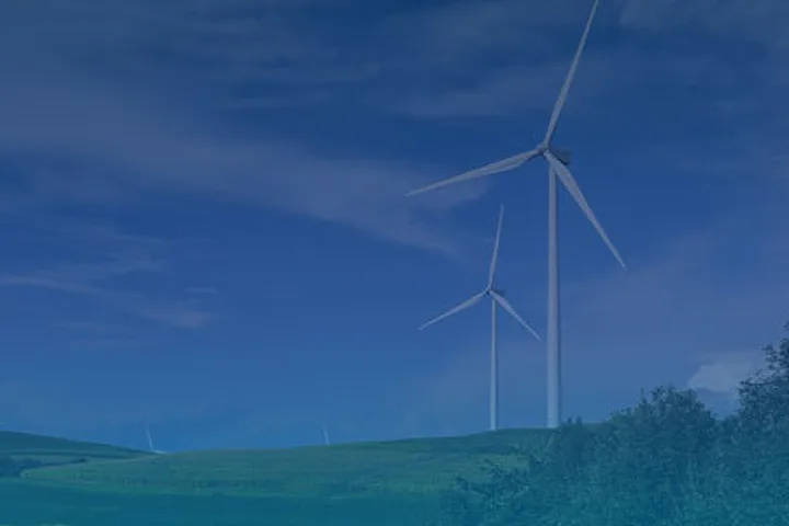 A photo of wind turbines on a hill