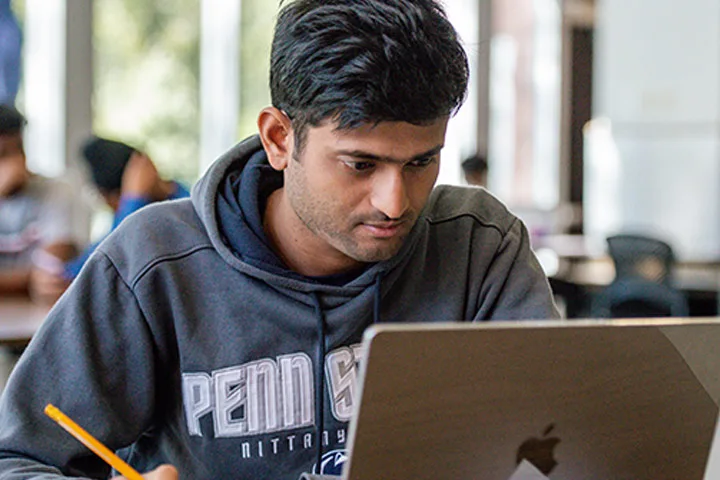 Photo of student with laptop