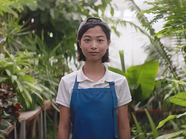 Student in greenhouse