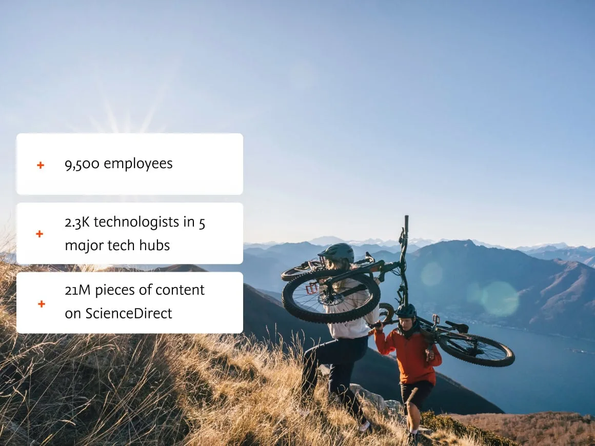 Two men with mountain bikes on a mountain