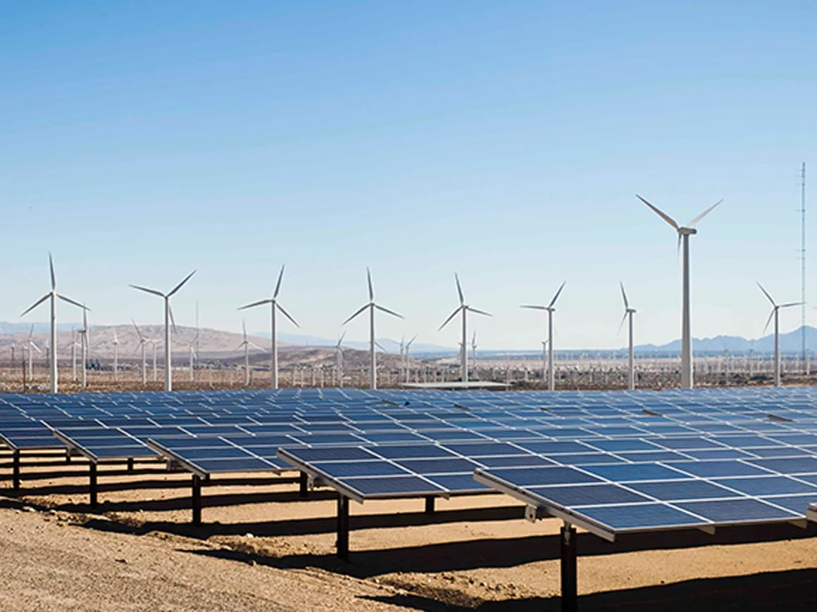 solar panels and windmills in the desert