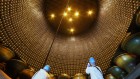 Huge neutrino detector sees first hints of particles from exploding stars