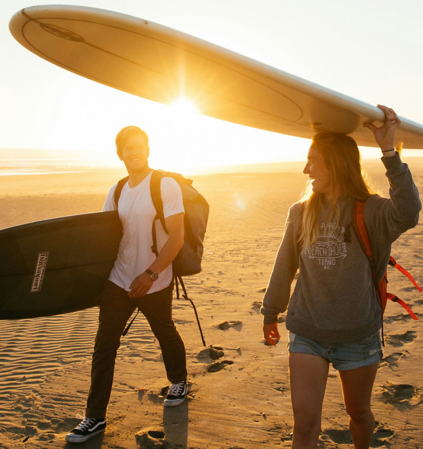 Surfers on a beach in Tofino BC.