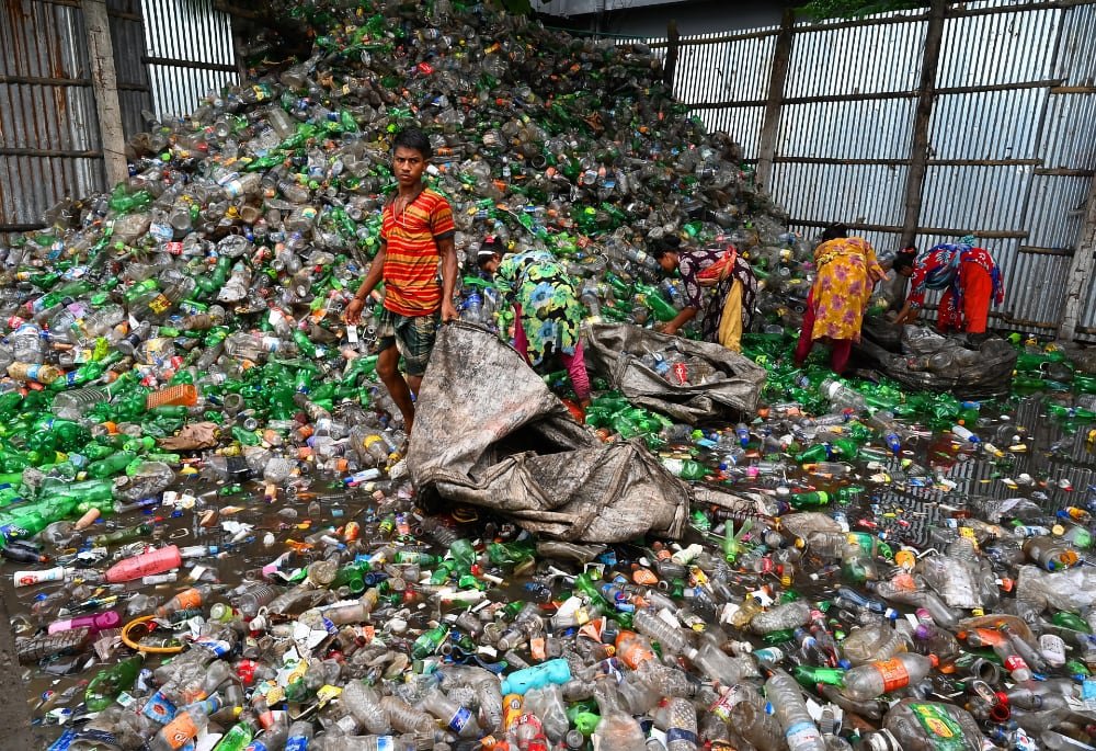 Collecting bottles from a landfill