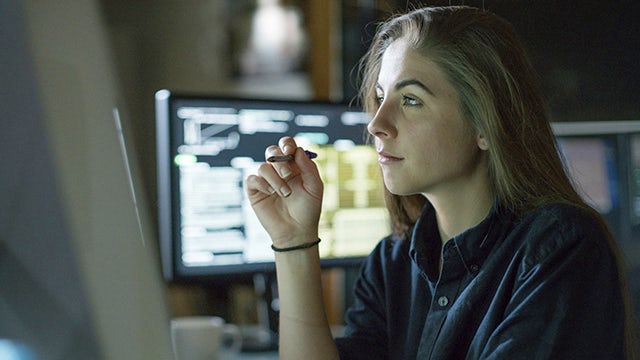 Woman working at the office on cloud solutions