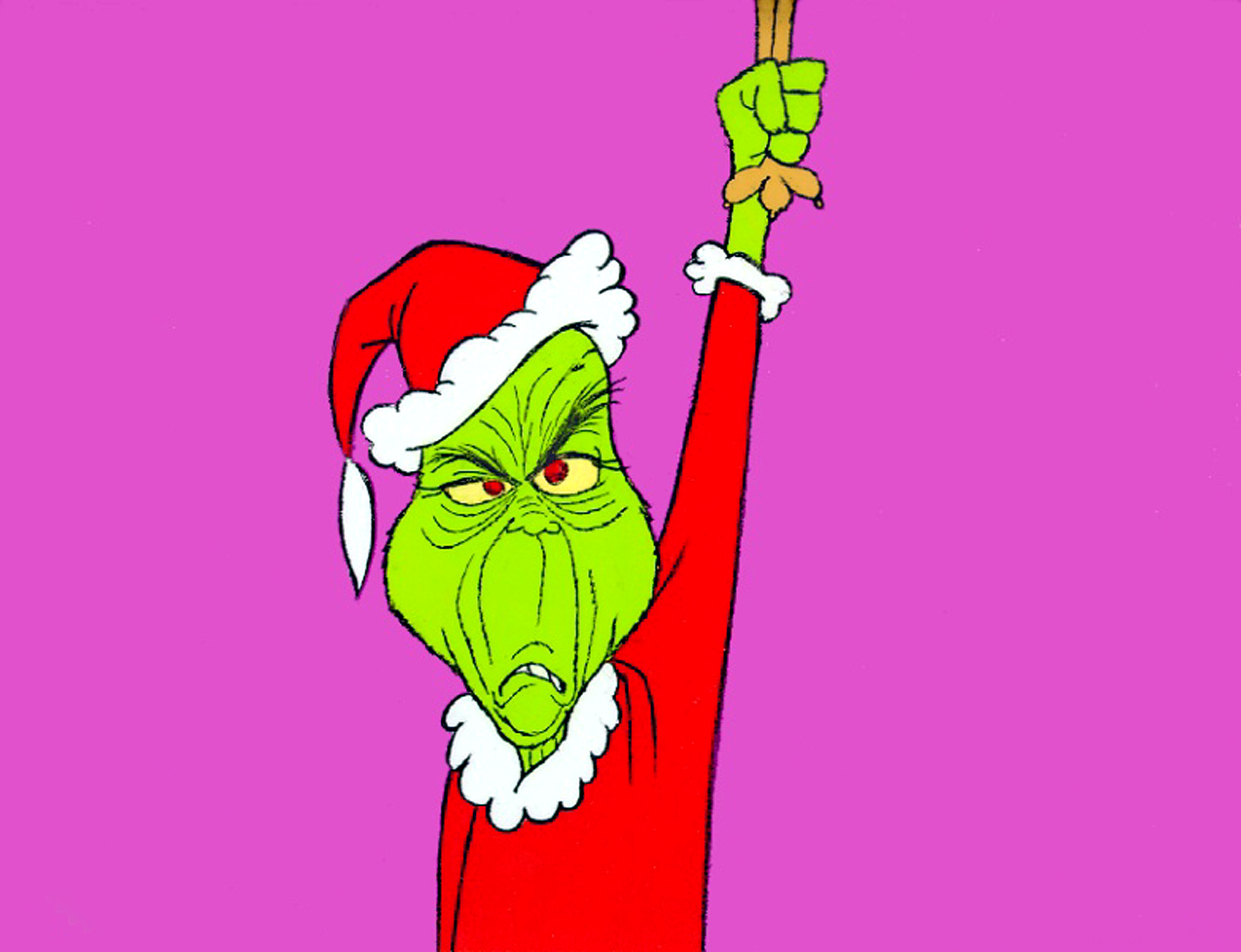 The Grinch, in a Santa outfit, raises an arm against a pink background, from the classic holiday TV special &quot;How the Grinch Stole Christmas.&quot;