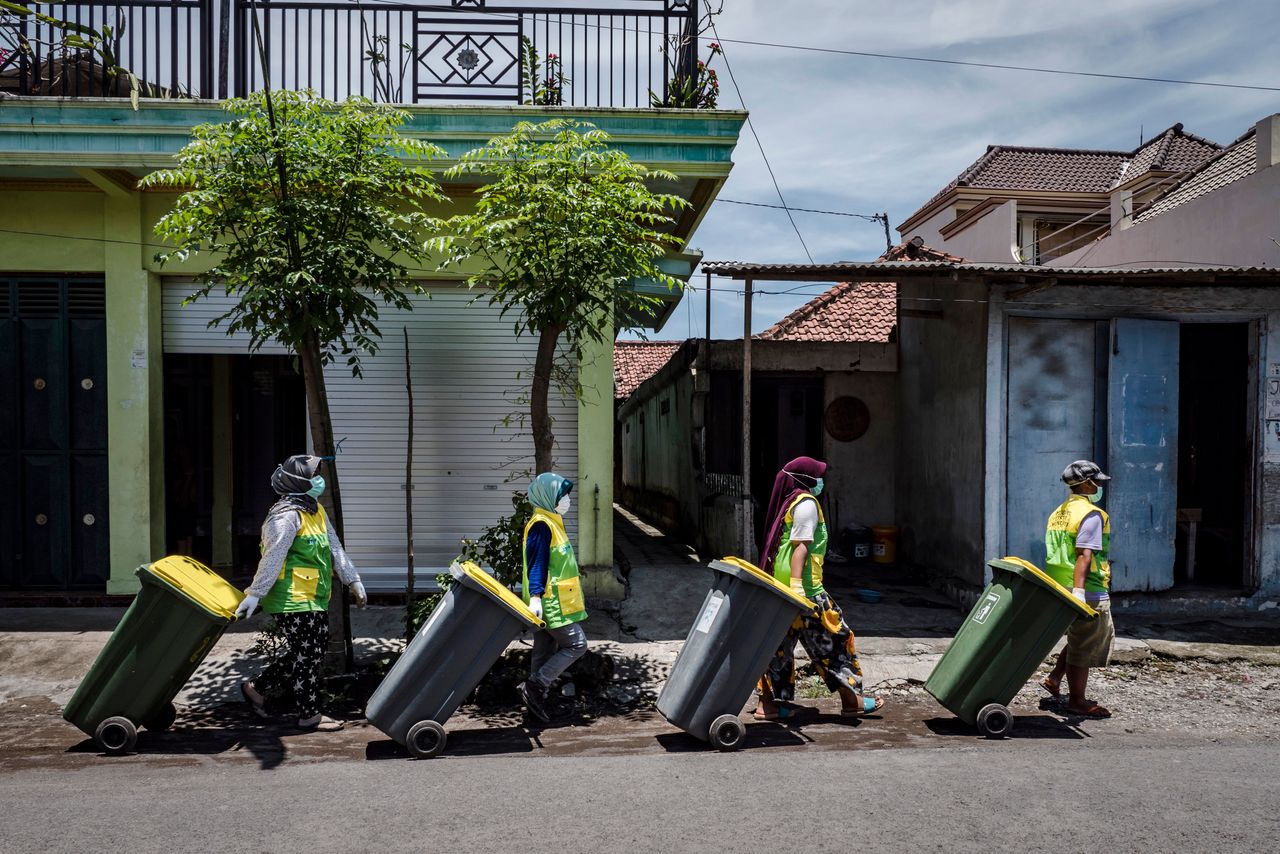 The Warriors of Waste go door to door collecting garbage from the community at Tembokrejo village in Muncar.