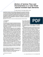 Numerical Prediction of Laminar F L o W and Heat Transfer Characteristics in A Tube Fitted With Regularly Spaced Twisted-Tape Elements