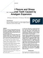 Cuspal Flexure and Stress in Restored Teeth Caused by Amalgam Expansion