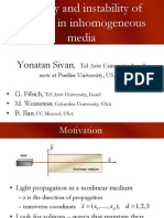 Stability and Instability of Solitons in Inhomogeneous Media