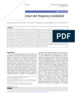 Broadband Quantum-Dot Frequency-Modulated Comb Laser