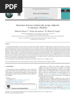 Interaction Between Inclined Pile Groups Subjected To Harmonic Vibrations