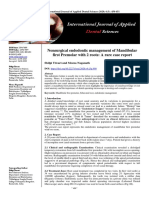 "Nonsurgical Endodontic Management of Mandibular First Premolar With 2 Roots: A Rare Case Report" Pub