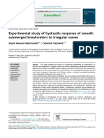 Experimental Study of Hydraulic Response of Smooth Submerged Breakwaters To Irregular Waves