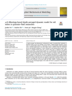 μ (J) -Rheology-based depth-averaged dynamic model for roll waves in granular-fluid avalanches