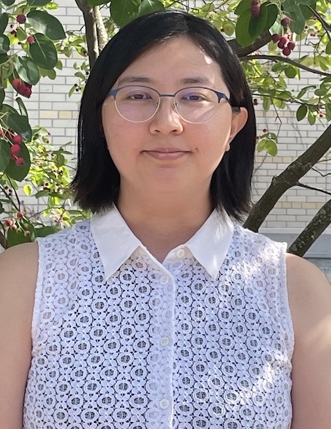 Jenny Lin in front of a serviceberry tree