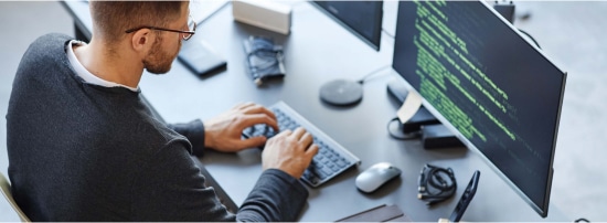 a person coding on his computer