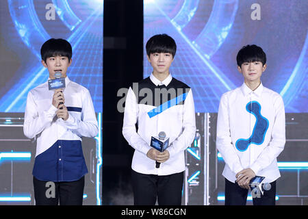 (From left) Yiyang Qianxi, Wang Junkai and Wang Yuan of Chinese boy group TFBoys attend a launch event for their new web drama 'Finding Soul' in Beiji Stock Photo