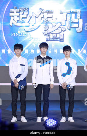 (From left) Yiyang Qianxi, Wang Junkai and Wang Yuan of Chinese boy group TFBoys attend a launch event for their new web drama 'Finding Soul' in Beiji Stock Photo