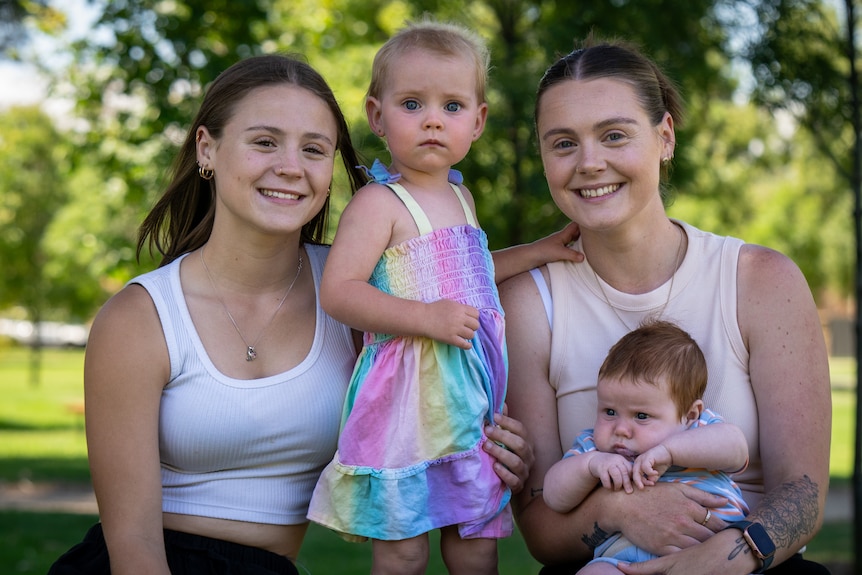 Demi Holloway (left) and Chelsea Holloway (right) outside WCH with Chelsea's two young children