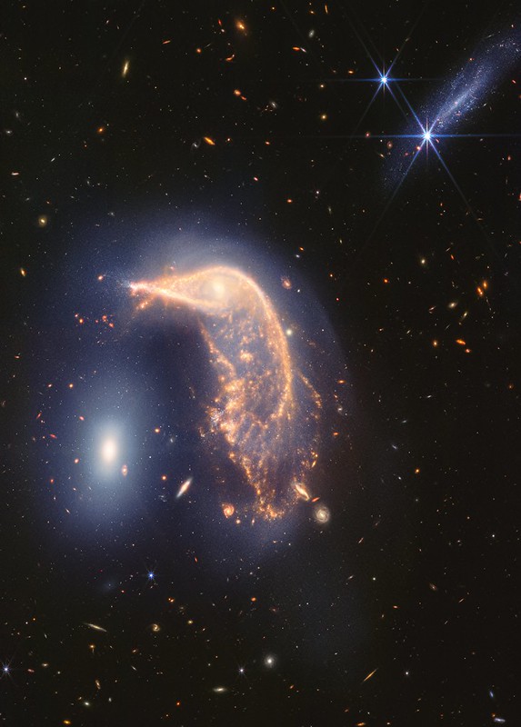 Vivid Portrait of Interacting Galaxies Marks Webb's Second Anniversary (NIRCam and MIRI)