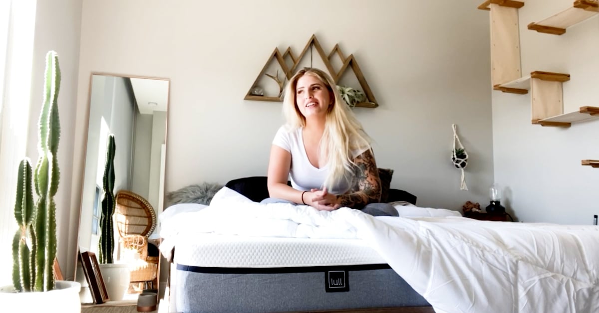 A woman in her bedroom with a lull.