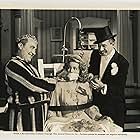 Chic Johnson, Martha O'Driscoll, and Ole Olsen in Ghost Catchers (1944)
