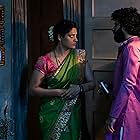 Saiyami Kher and Roshan Mathew in Choked (2020)