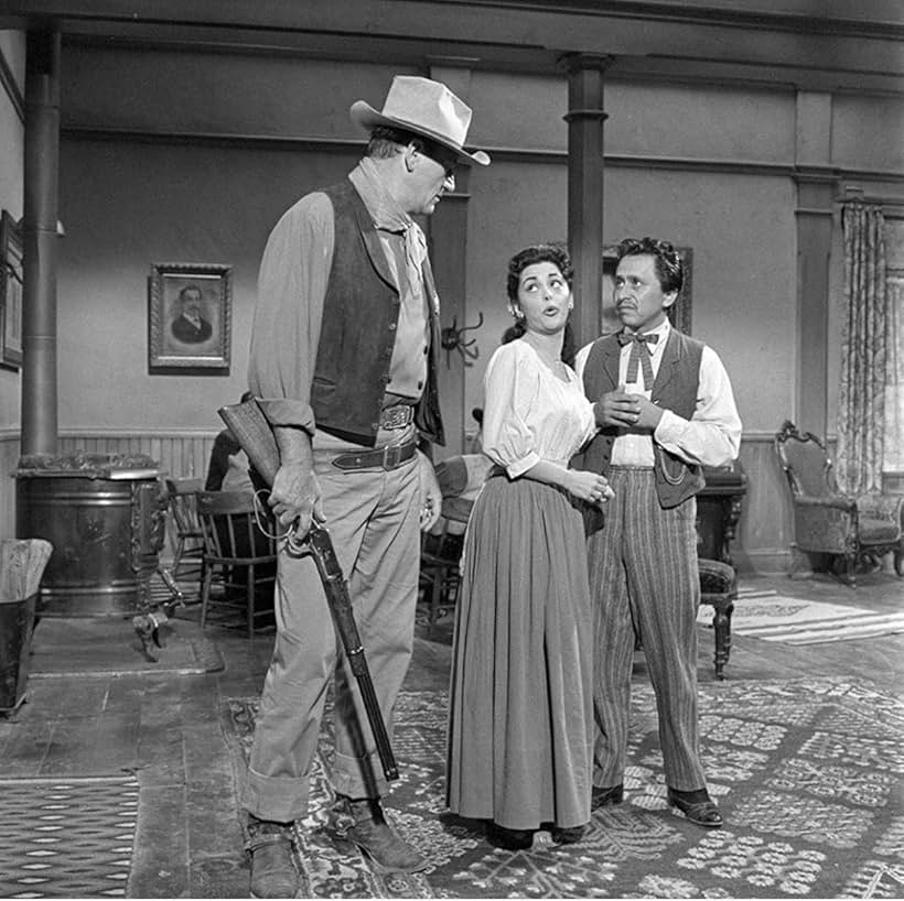 John Wayne, Pedro Gonzalez Gonzalez, and Estelita Rodriguez in Rio Bravo (1959)