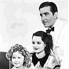 Shirley Temple, John Boles, and Rochelle Hudson in Curly Top (1935)
