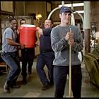 Rookie firefighter Jack Morrison (Joaquin Phoenix, right) gets a "shower" from firehouse comrades Don Miller (Kevin Daniels. Left), Captain Mike Kennedy (John Travolta, center left) and Frank McKinney (Kevin Chapman, center right).