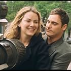 Newly married, Linda (Jacinda Barrett, left) and Jack Morrison (Joaquin Phoenix, right) share a ride on the back of the Ladder 49 fire truck.