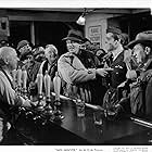 Guy Bellis, Aubrey Mather, Richard Ney, and Walter Pidgeon in Mrs. Miniver (1942)