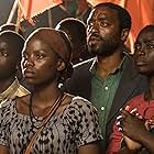 Chiwetel Ejiofor, Aïssa Maïga, Maxwell Simba, and Lily Banda in The Boy Who Harnessed the Wind (2019)