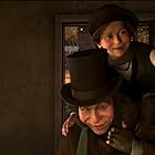 Gary Oldman, Ryan Ochoa, and Sage Ryan in A Christmas Carol (2009)